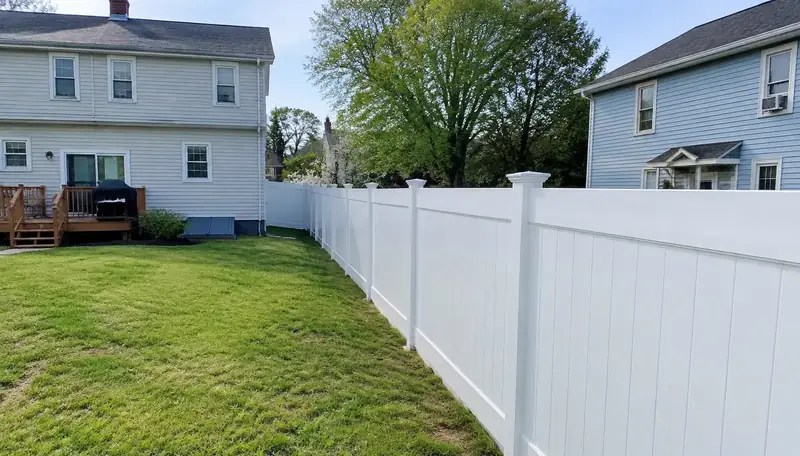 Tan vinyl fence in Greater Boston